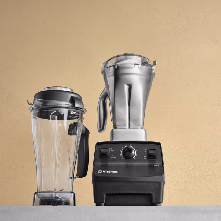 Vitamix 5200 blender with stainless and clear containers on a kitchen counter