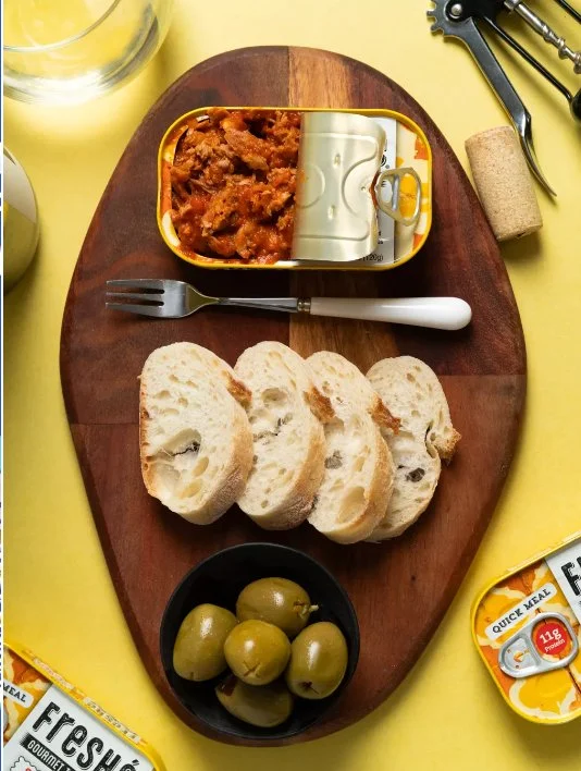 Freshé Sicilian Caponata open tin with bread and olives